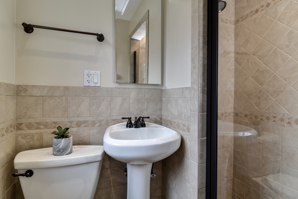 3 Swanson Road Framingham, MA 01701 - Photo 17 of 38 a bathroom with a sink toilet and a mirror