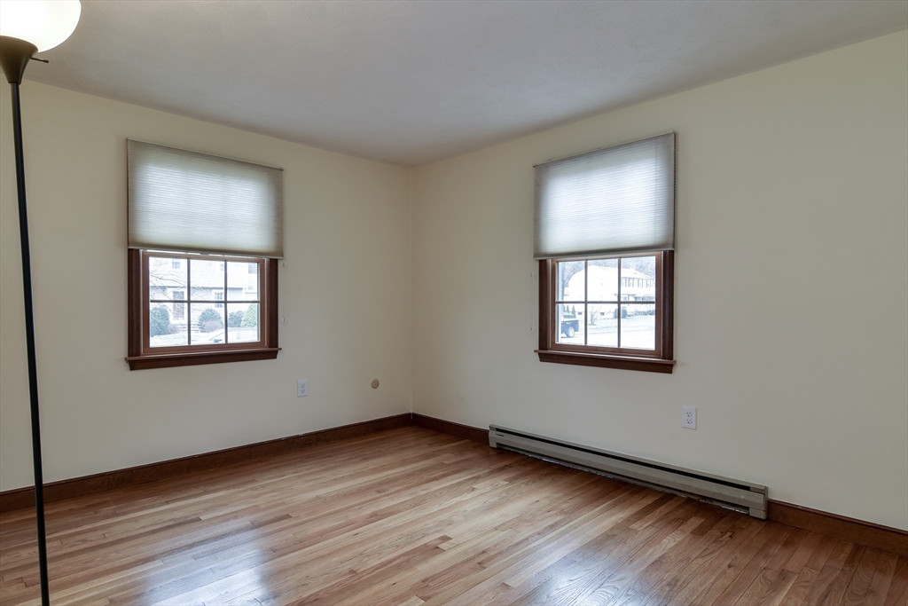 3 Swanson Road Framingham, MA 01701 - Photo 18 of 38 a view of an empty room with wooden floor and a window