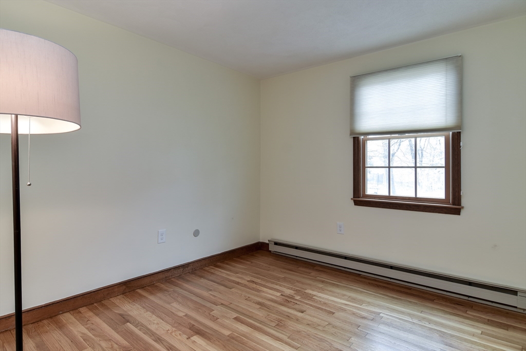 3 Swanson Road Framingham, MA 01701 - Photo 20 of 38 an empty room with wooden floor and windows
