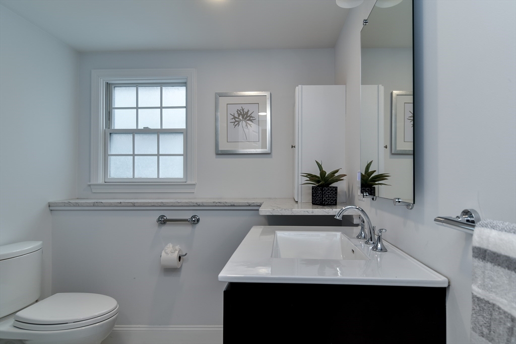 3 Swanson Road Framingham, MA 01701 - Photo 25 of 38 a bathroom with a sink toilet and mirror