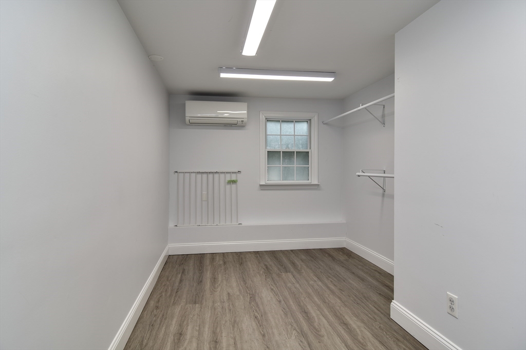 3 Swanson Road Framingham, MA 01701 - Photo 29 of 38 wooden floor in an empty room with a window