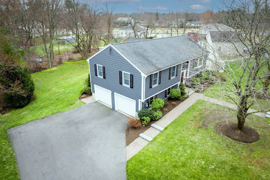 3 Swanson Road Framingham, MA 01701 - Photo 36 of 38 an aerial view of a house next to a big yard