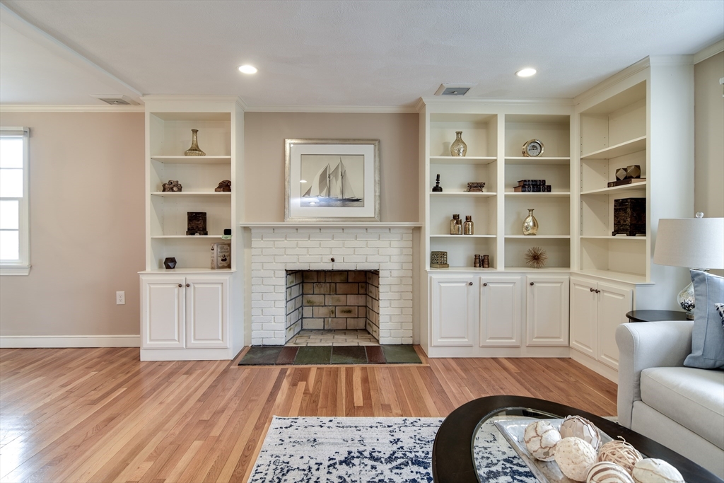 3 Swanson Road Framingham, MA 01701 - Photo 4 of 38 a spacious bedroom with a bed and a fireplace