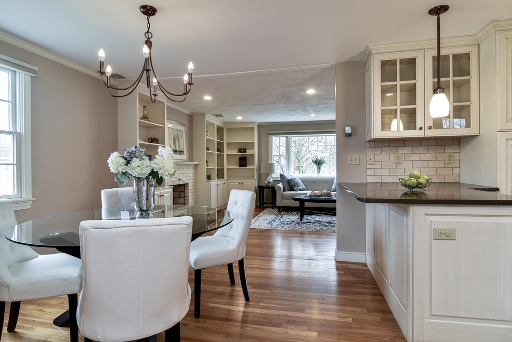 3 Swanson Road Framingham, MA 01701 - Photo 9 of 38 a dining room with wooden floor and chandelier