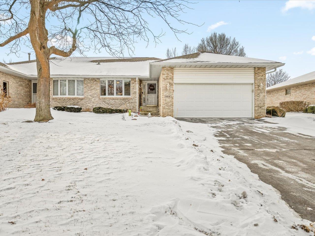 968 Falcon Point Place Rockton, IL 61072 - Photo 1 of 38 a front view of a house with a yard and garage