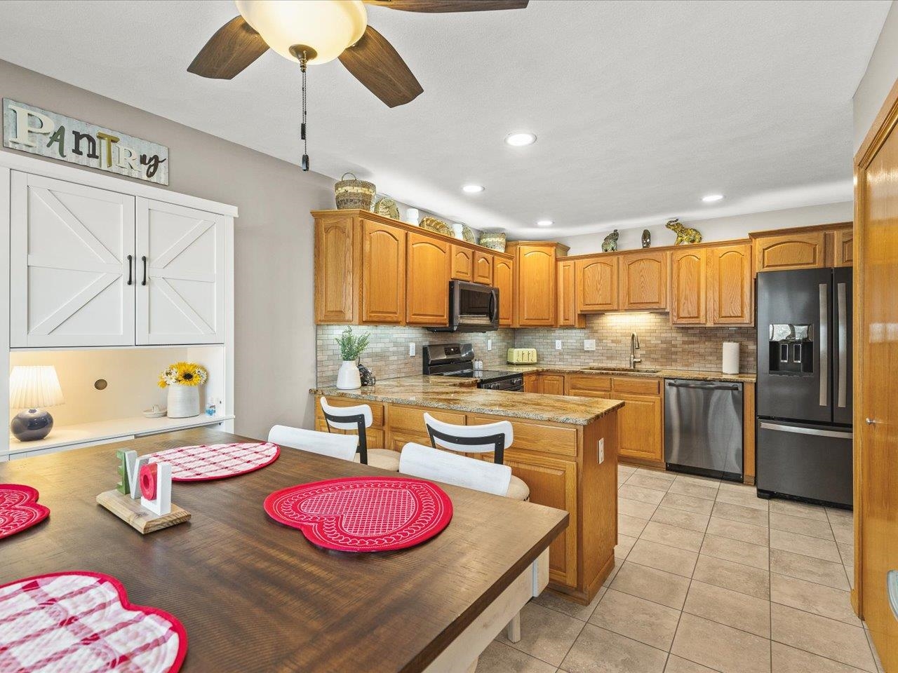 968 Falcon Point Place Rockton, IL 61072 - Photo 15 of 38 a kitchen with a sink stove and refrigerator
