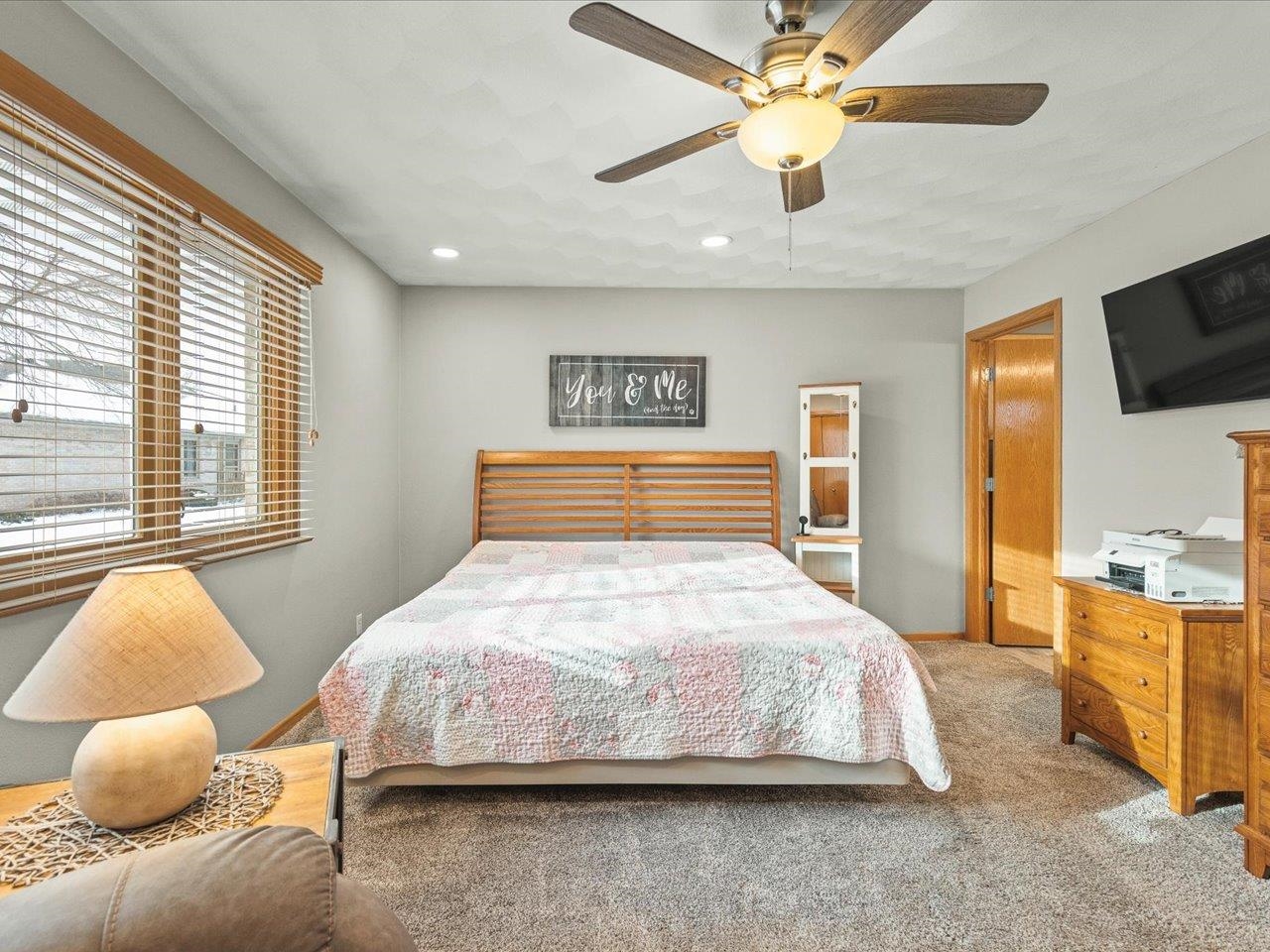 968 Falcon Point Place Rockton, IL 61072 - Photo 18 of 38 a bedroom with a large bed and flat tv