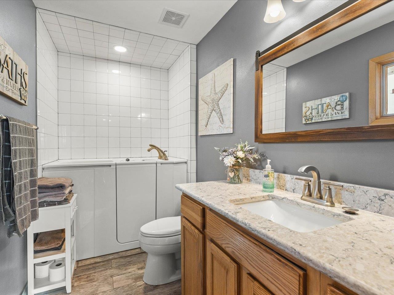 968 Falcon Point Place Rockton, IL 61072 - Photo 20 of 38 a bathroom with a granite countertop toilet sink and mirror