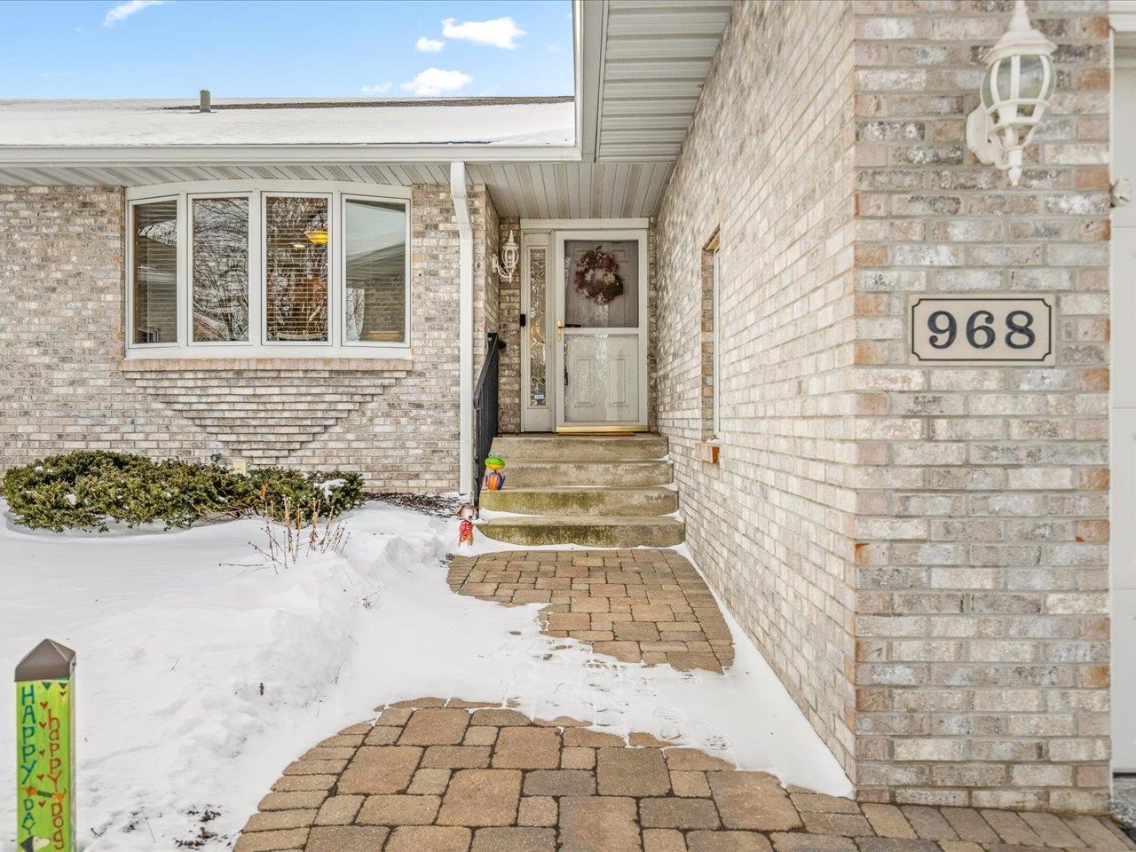 968 Falcon Point Place Rockton, IL 61072 - Photo 2 of 38 a view of a brick house with an outdoor space