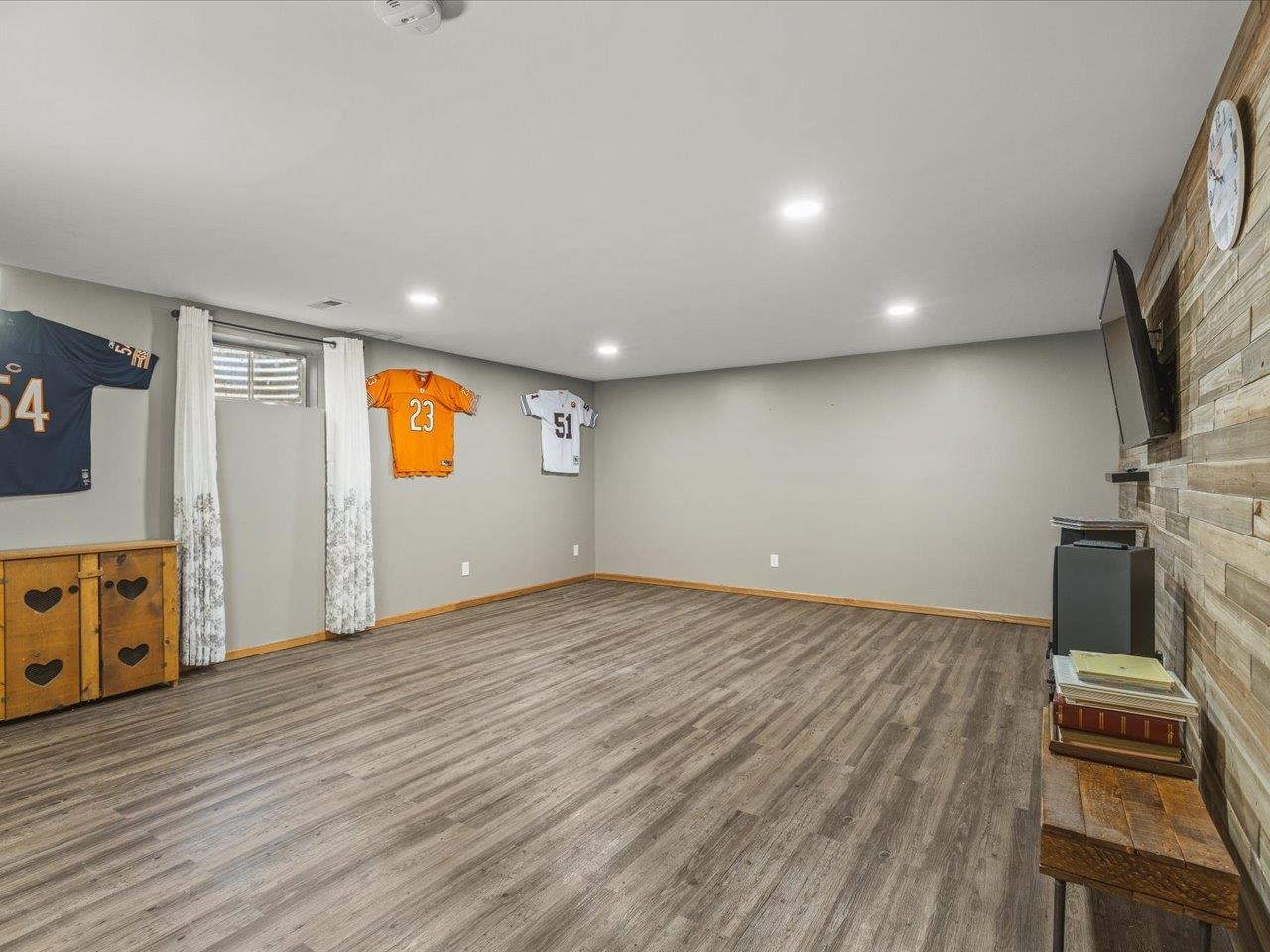 968 Falcon Point Place Rockton, IL 61072 - Photo 24 of 38 wooden floor in an empty room with a window