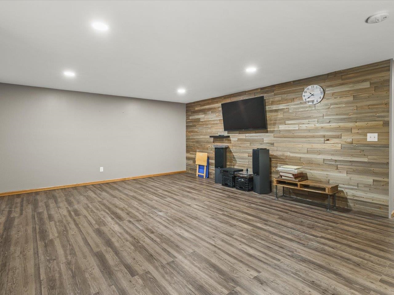 968 Falcon Point Place Rockton, IL 61072 - Photo 25 of 38 a view of a room with wooden floor and a flat screen tv