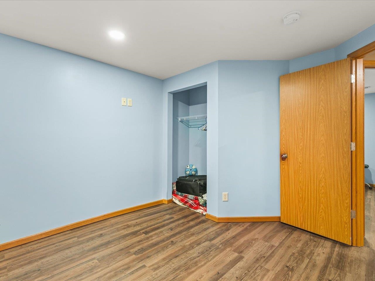 968 Falcon Point Place Rockton, IL 61072 - Photo 28 of 38 a view of a room with wooden floor and closet