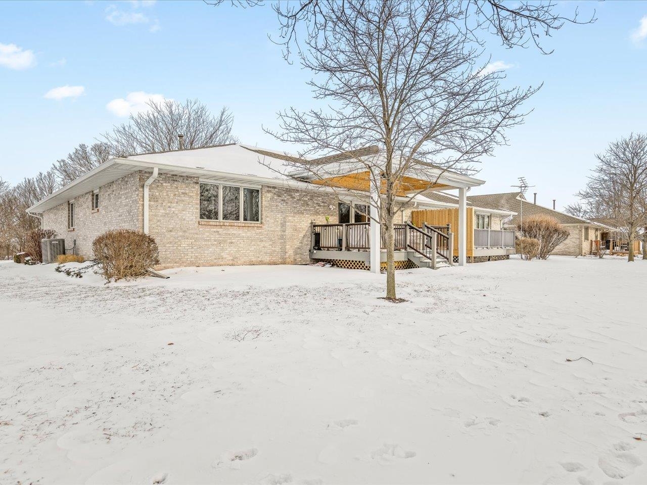 968 Falcon Point Place Rockton, IL 61072 - Photo 35 of 38 a white house that has a tree on the side of it