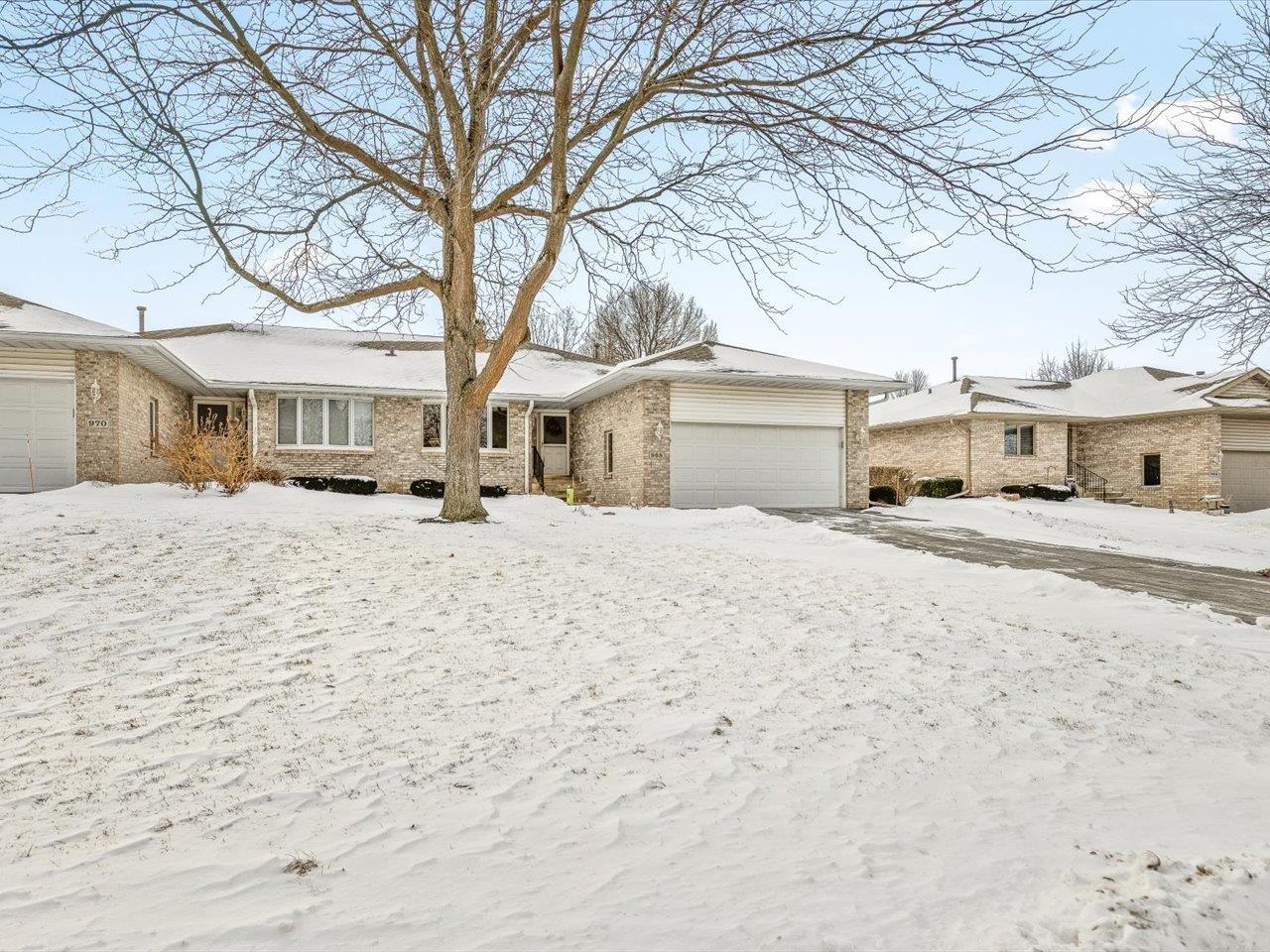968 Falcon Point Place Rockton, IL 61072 - Photo 36 of 38 a view of a white house with a yard covered in snow
