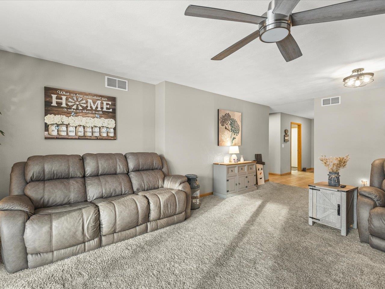 968 Falcon Point Place Rockton, IL 61072 - Photo 8 of 38 a living room with furniture and a flat screen tv