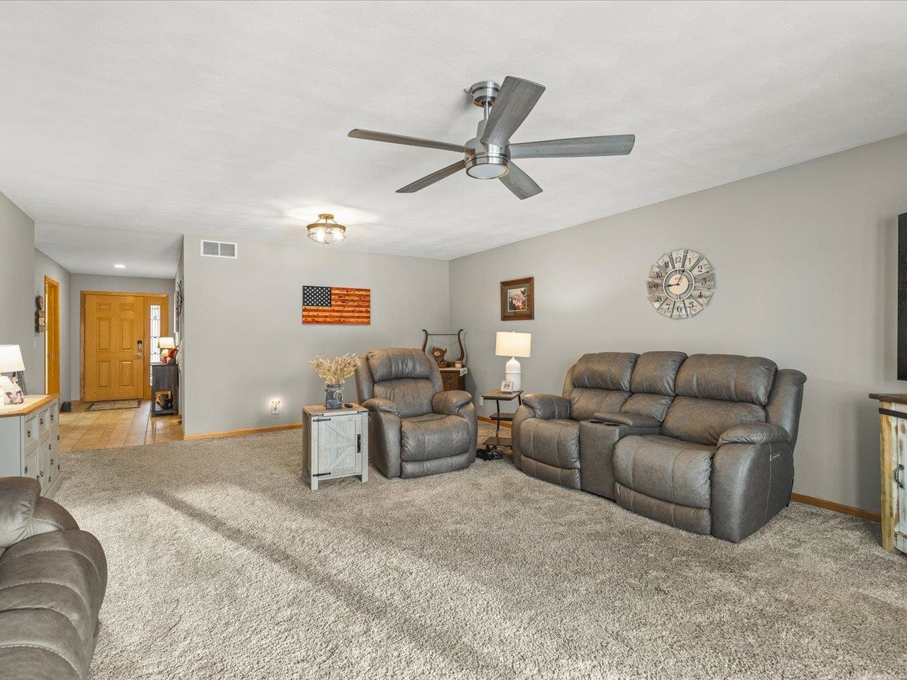 968 Falcon Point Place Rockton, IL 61072 - Photo 9 of 38 a living room with furniture and a large window