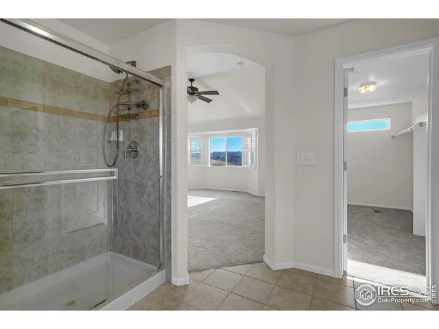 a bathroom with a glass shower door