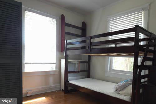 2504 Queen Anne Road Baltimore, MD 21216 - Photo 18 of 36 a room with walk in closet and window