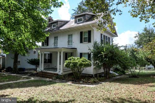 2504 Queen Anne Road Baltimore, MD 21216 - Photo 2 of 36 a front view of a house with garden