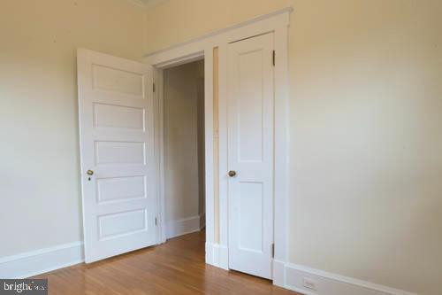 2504 Queen Anne Road Baltimore, MD 21216 - Photo 21 of 36 a view of an empty room and wooden floor