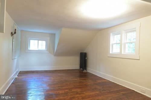 2504 Queen Anne Road Baltimore, MD 21216 - Photo 26 of 36 an empty room with wooden floor and windows