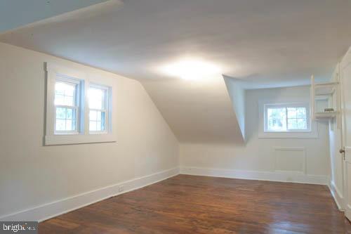 2504 Queen Anne Road Baltimore, MD 21216 - Photo 27 of 36 an empty room with wooden floor and windows