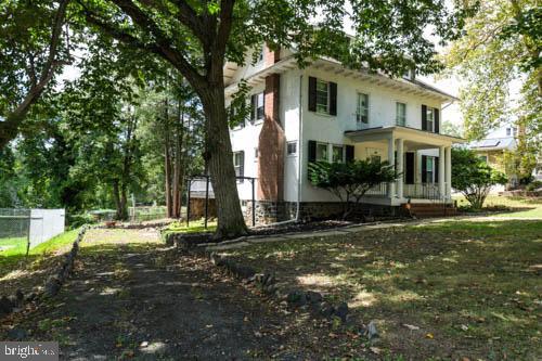 2504 Queen Anne Road Baltimore, MD 21216 - Photo 34 of 36 front view of a house with a yard