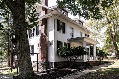 2504 Queen Anne Road Baltimore, MD 21216 - Photo 35 of 36 a front view of a house with yard
