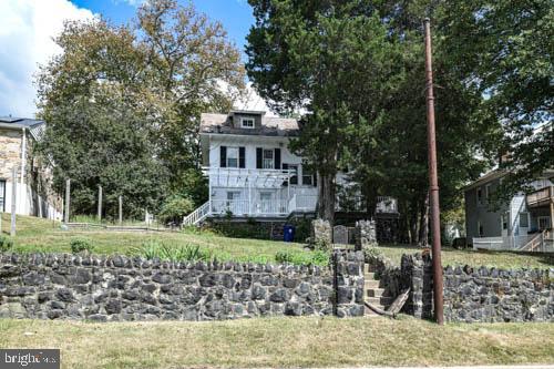 2504 Queen Anne Road Baltimore, MD 21216 - Photo 36 of 36 a front view of a house with a yard