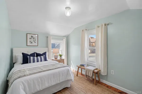 a bedroom with a bed and a table in it