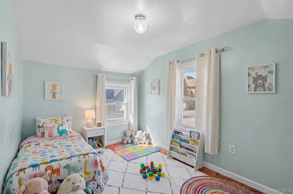 a bedroom with a bed and a table in it