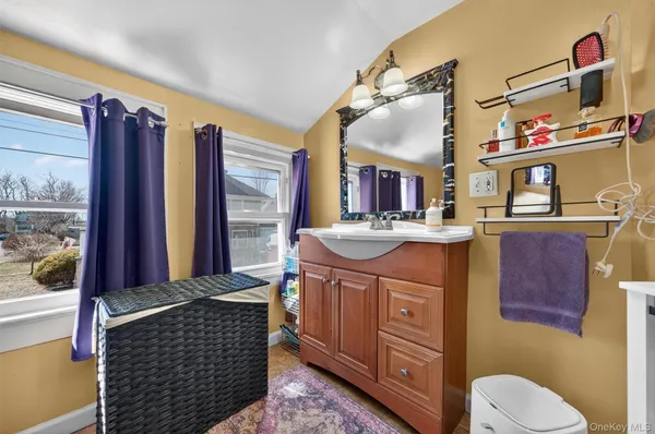 a bathroom with a sink a vanity and a mirror