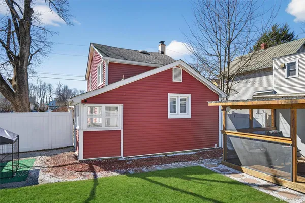 a view of backyard with a garden and deck