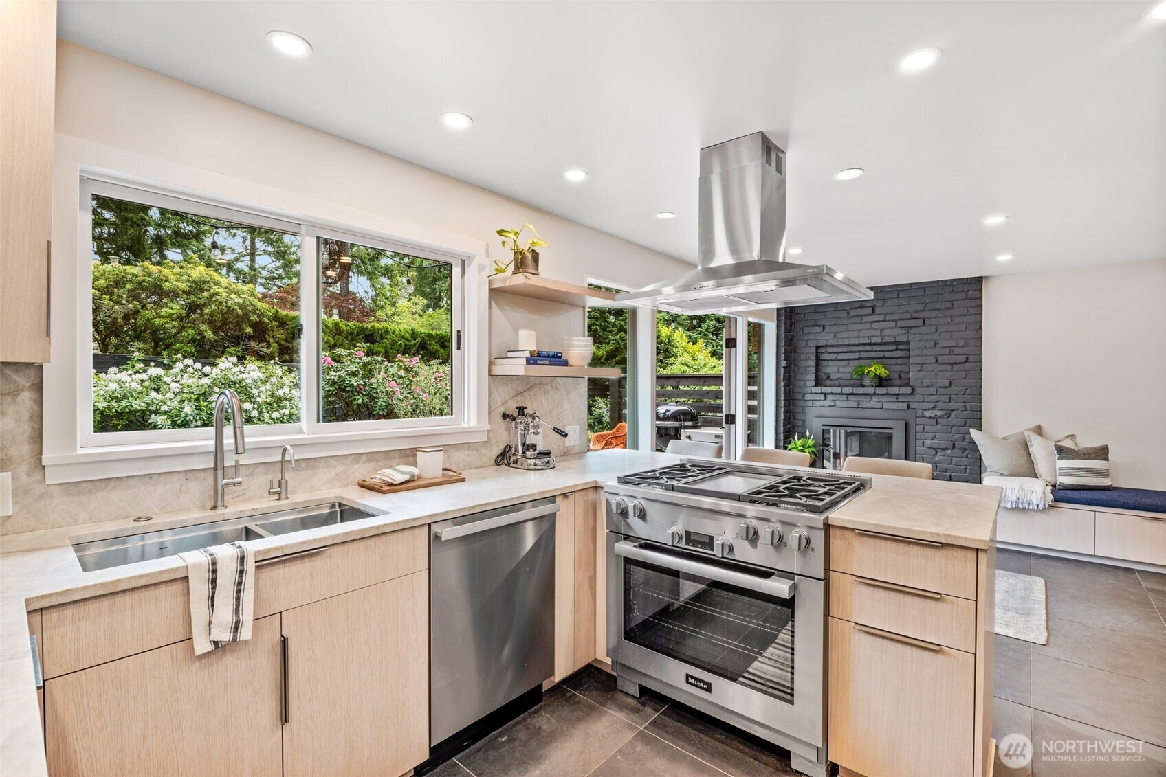 13526 Northshire Road Northwest Seattle, WA 98177 - Photo 12 of 40 a kitchen that has a sink a stove and a wooden floors