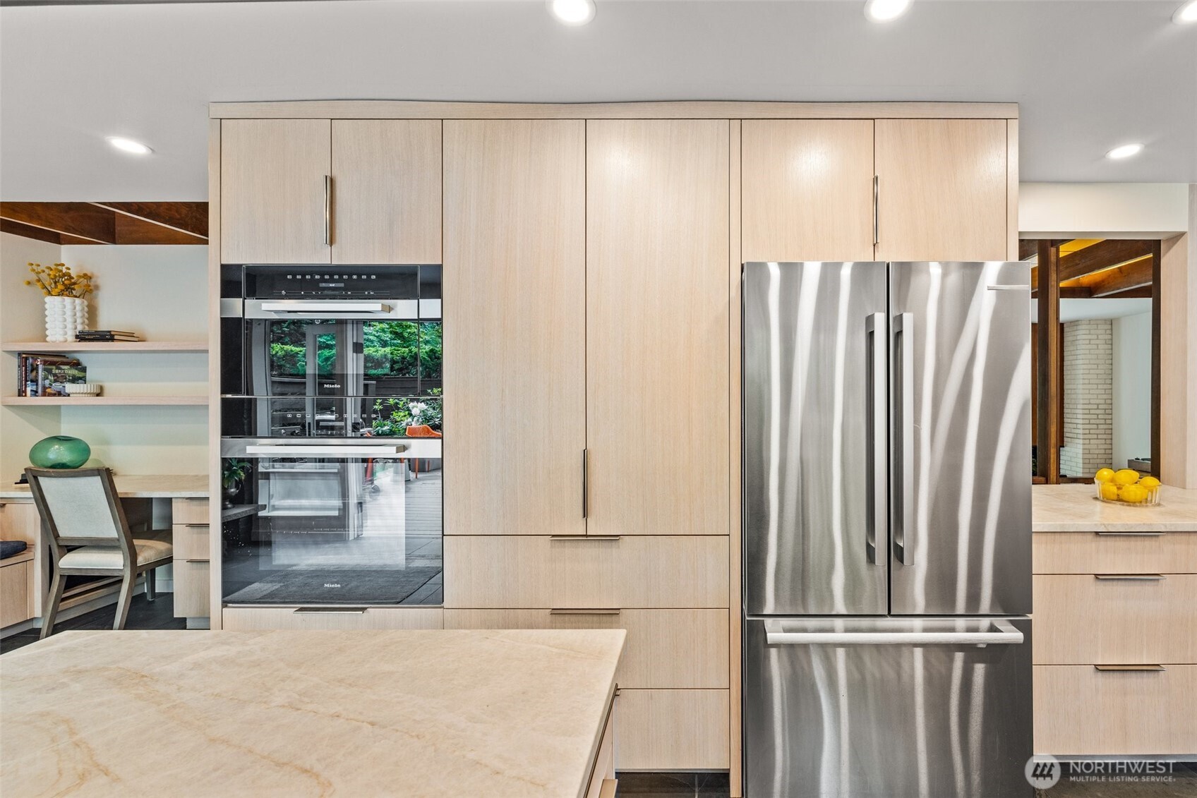 13526 Northshire Road Northwest Seattle, WA 98177 - Photo 13 of 40 a kitchen with stainless steel appliances a refrigerator and cabinets