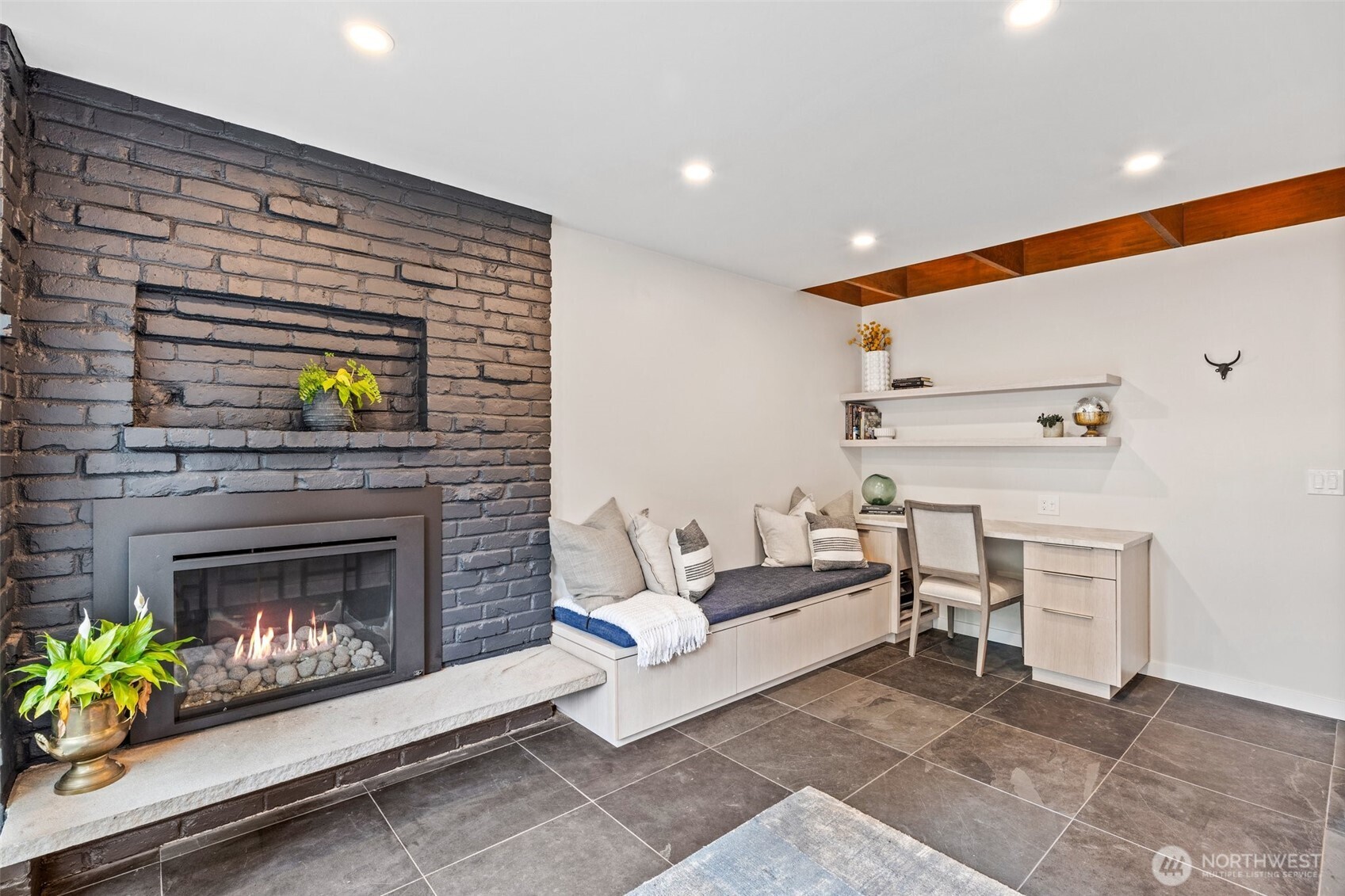 13526 Northshire Road Northwest Seattle, WA 98177 - Photo 16 of 40 a living room with furniture and a fireplace