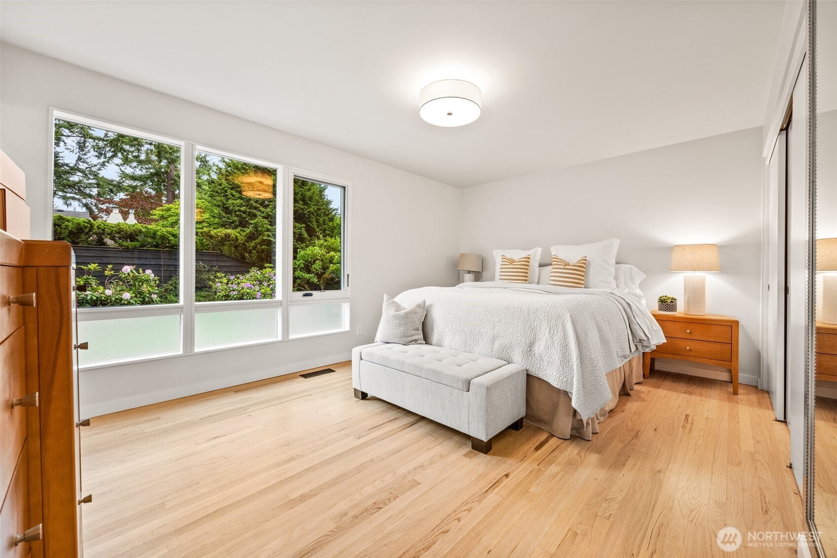 13526 Northshire Road Northwest Seattle, WA 98177 - Photo 17 of 40 a bedroom with a bed and large window