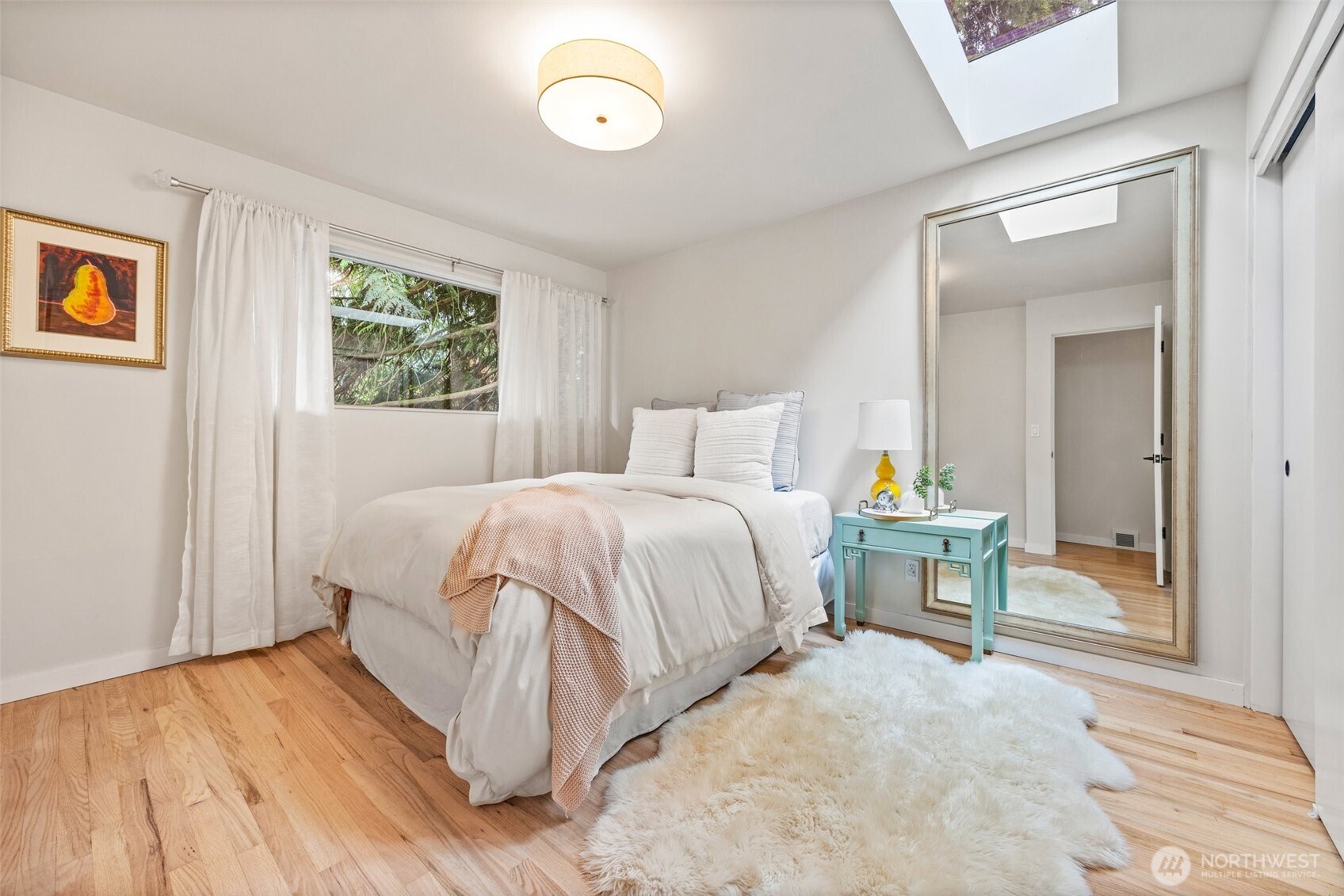 13526 Northshire Road Northwest Seattle, WA 98177 - Photo 20 of 40 a bedroom with a bed and a painting on the wall