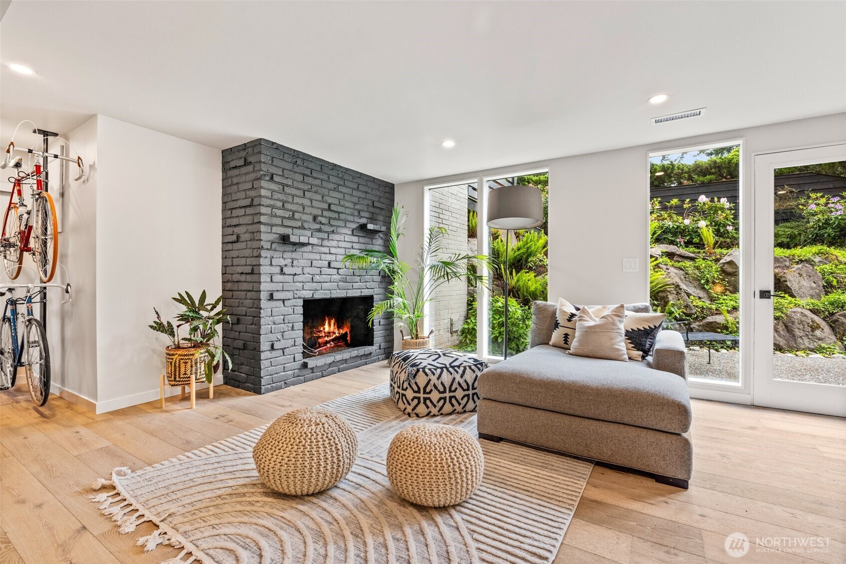 13526 Northshire Road Northwest Seattle, WA 98177 - Photo 24 of 40 a bedroom with furniture and a fireplace