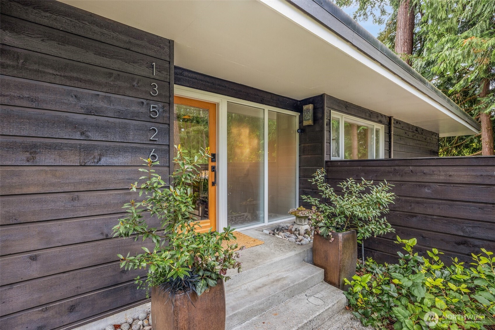 13526 Northshire Road Northwest Seattle, WA 98177 - Photo 3 of 40 a front view of a house with a yard