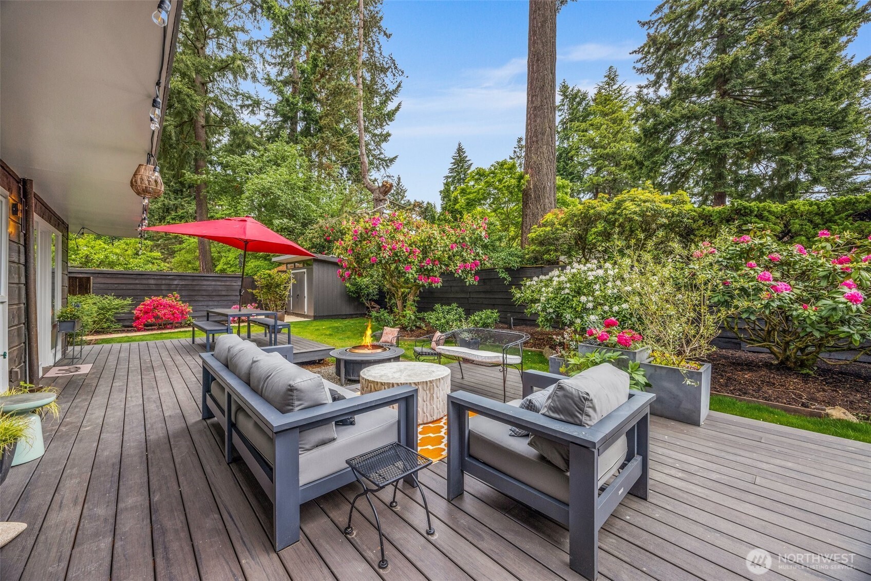 13526 Northshire Road Northwest Seattle, WA 98177 - Photo 31 of 40 an outdoor sitting area with furniture and wooden deck