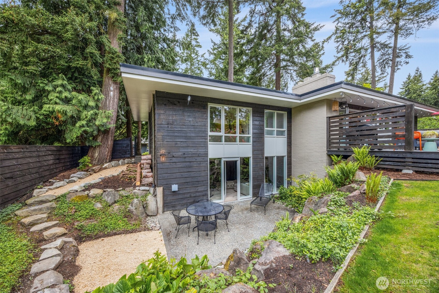 13526 Northshire Road Northwest Seattle, WA 98177 - Photo 36 of 40 a front view of a house with a garden
