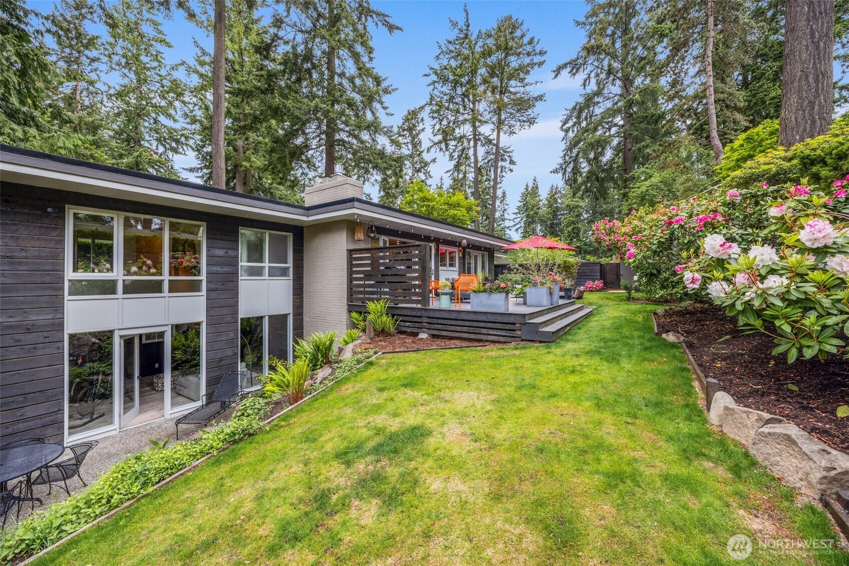 13526 Northshire Road Northwest Seattle, WA 98177 - Photo 37 of 40 a view of house with backyard space and garden