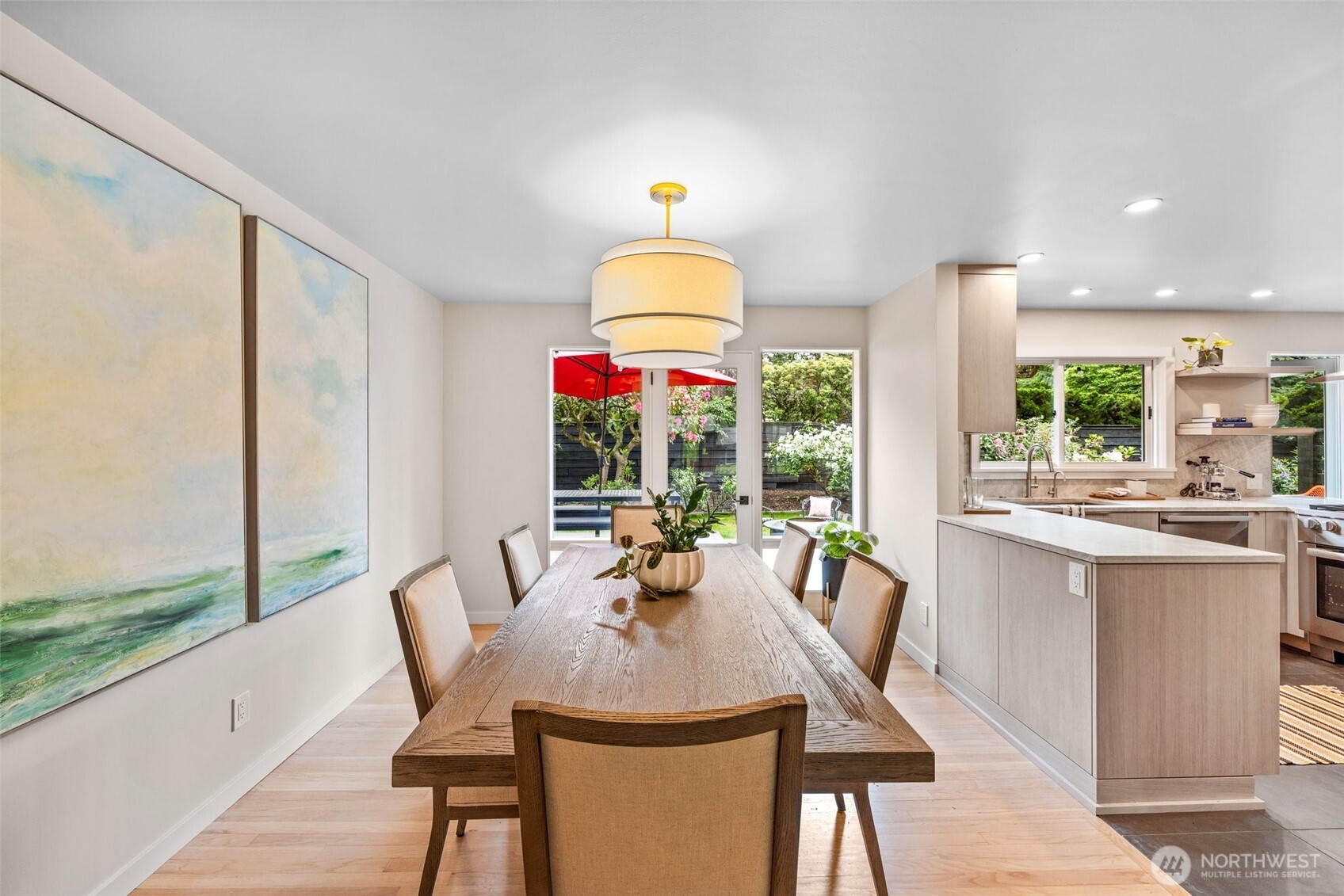 13526 Northshire Road Northwest Seattle, WA 98177 - Photo 10 of 40 a dining room with furniture a chandelier and wooden floor