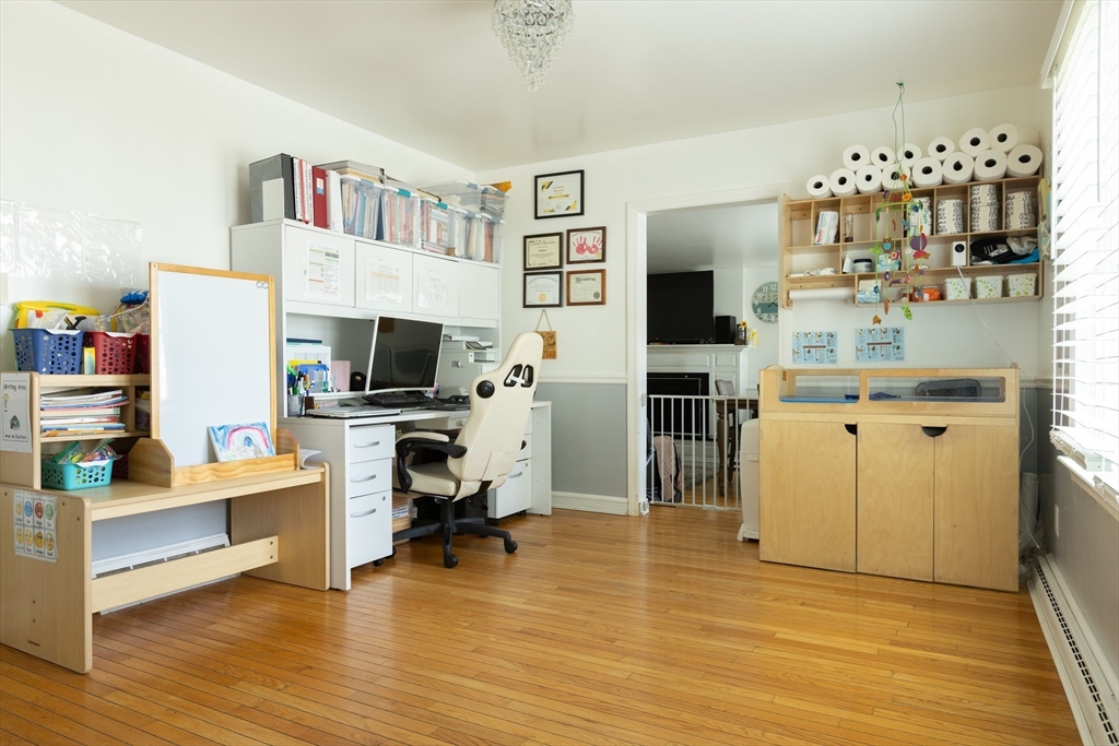 25 Beaconsfield Street Lawrence, MA 01843 - Photo 12 of 36 a living room with furniture and a flat screen tv