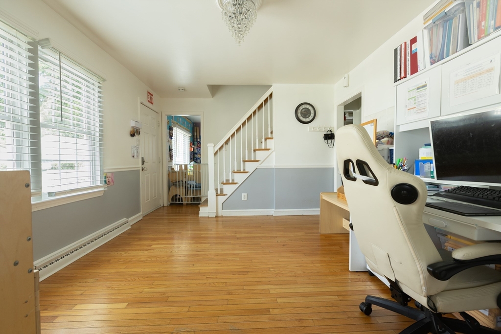 25 Beaconsfield Street Lawrence, MA 01843 - Photo 16 of 36 a view of a workspace with furniture and a window