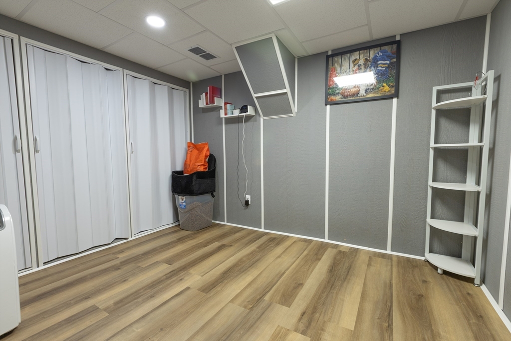 25 Beaconsfield Street Lawrence, MA 01843 - Photo 19 of 36 a room that has a bed and a window