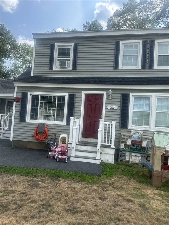 25 Beaconsfield Street Lawrence, MA 01843 - Photo 2 of 36 a front view of a house with a garden