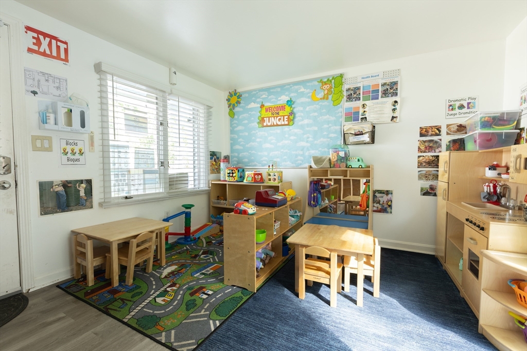 25 Beaconsfield Street Lawrence, MA 01843 - Photo 23 of 36 a living room with furniture and a wooden floor
