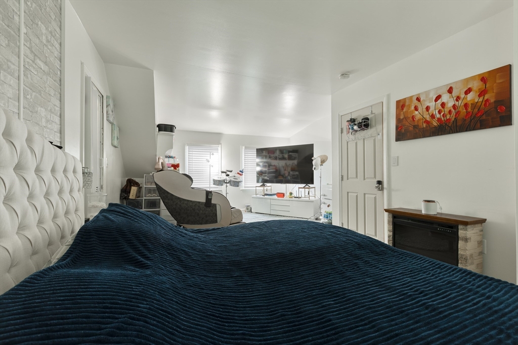 25 Beaconsfield Street Lawrence, MA 01843 - Photo 26 of 36 a living room with furniture and a flat screen tv